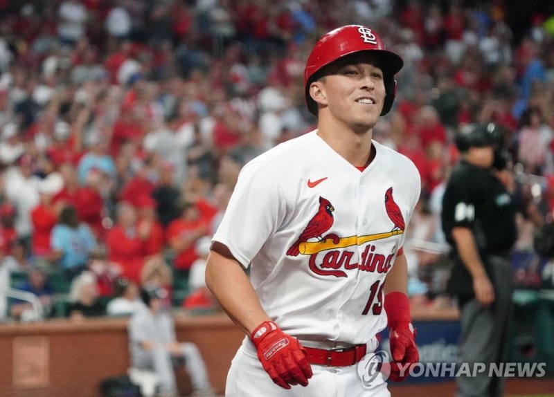 Tommy Edman #19 of the St. Louis Cardinals returns to the dugout